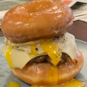 Hamburger wrapped in a donut